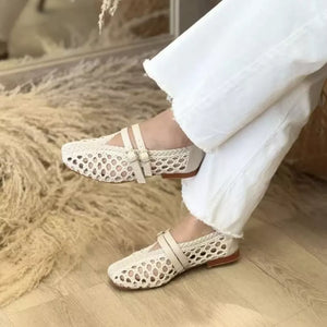 Flats in cream featuring hollow-out design and Mary Jane fit