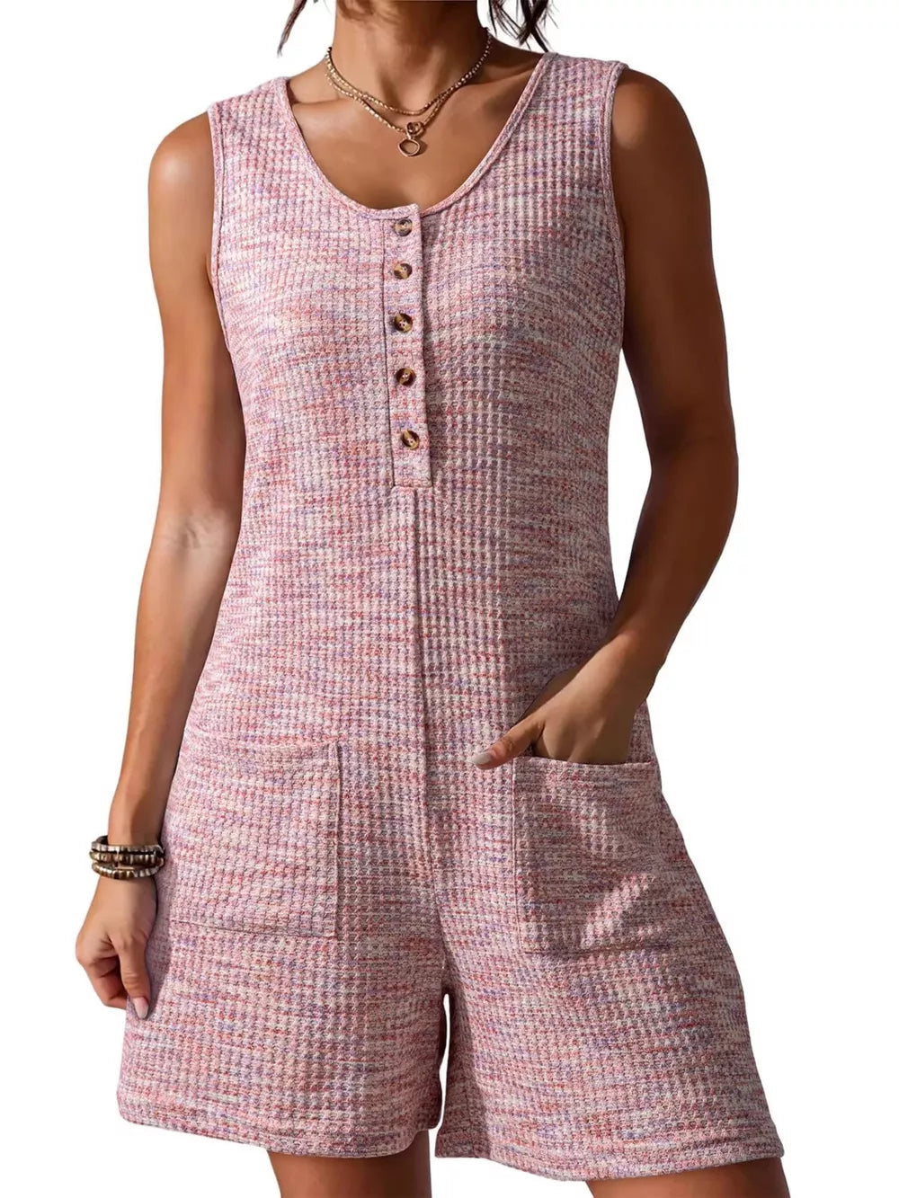 Pink textured button front romper with scoop neck and patch pockets