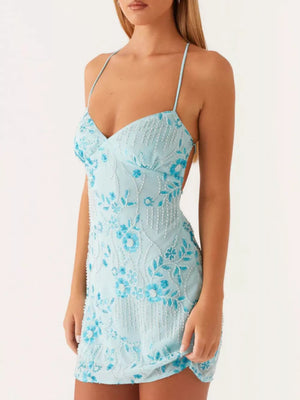 Pastel blue floral mini dress with beaded embellishments and spaghetti straps.