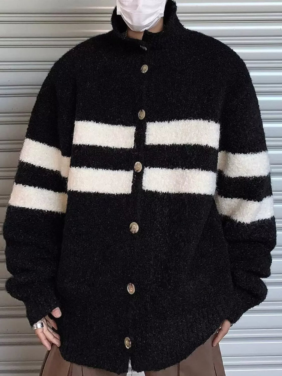Black and white striped knit button-down cardigan with a mock neck and textured fabric.