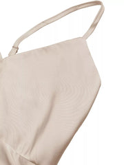 Lustrous V-neck maxi dress with spaghetti straps in a light neutral color.