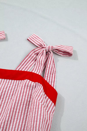 Maxi dress with red and white stripes, red trim, and bow knot shoulder straps.