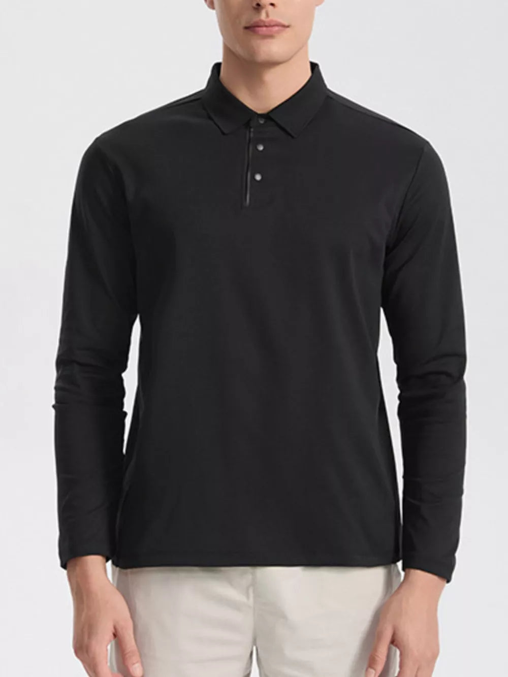 Men's black long sleeve polo shirt with classic fit and button placket.
