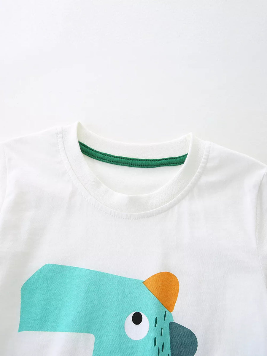 White cotton toddler tee with crew neck and playful cartoon character graphic.