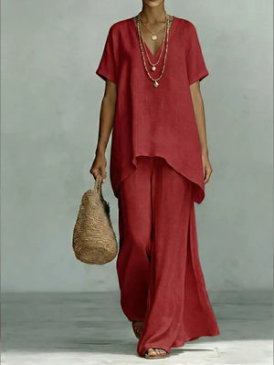 Red linen v-neck short sleeve tunic and wide leg pants set with layered necklaces.
