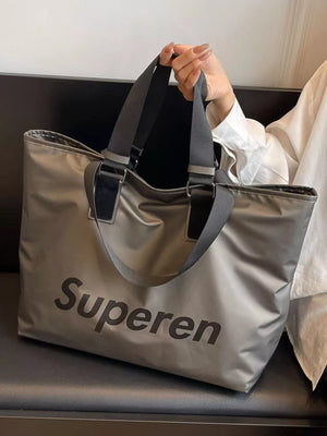 Spacious grey Oxford cloth travel shoulder bag with black "Superen" logo and dual straps.