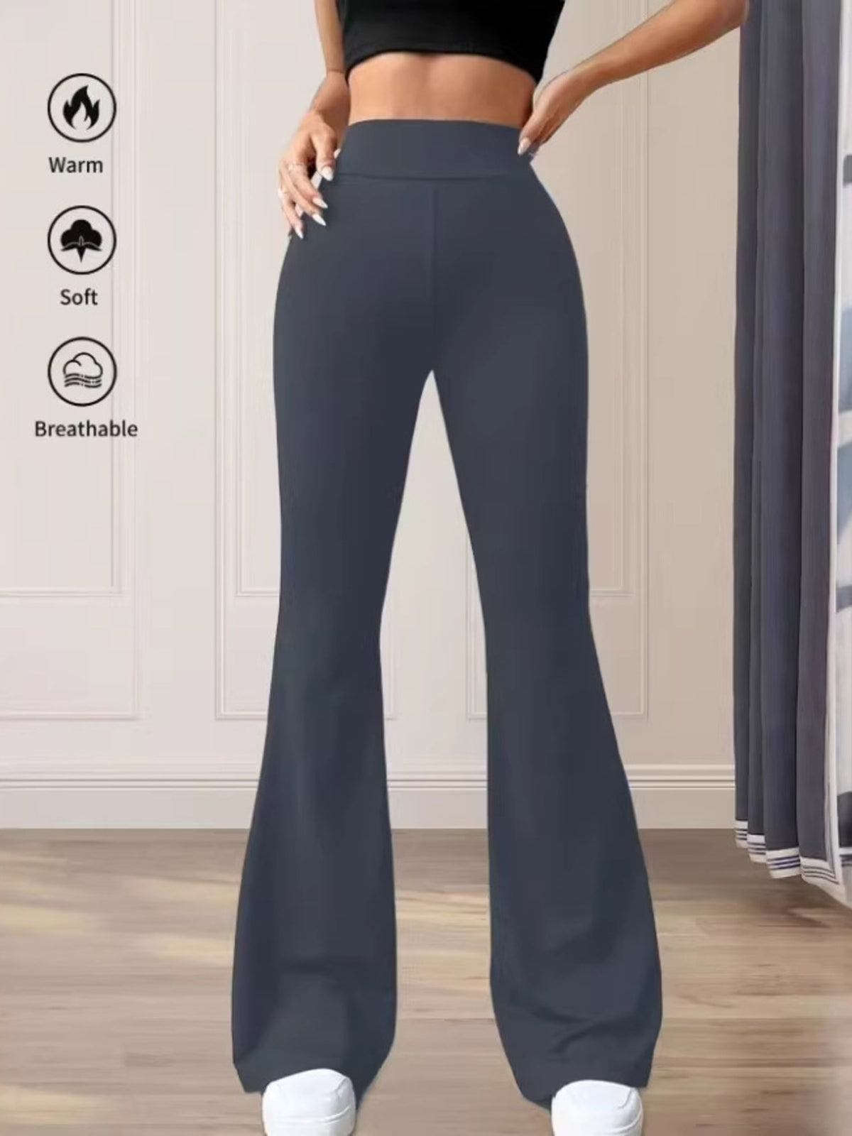 Premium high waist flare pants in gray cotton, styled casually.