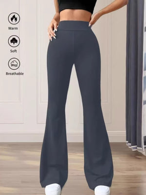 Premium high waist flare pants in gray cotton, styled casually.