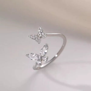 clear ring featuring adjustable and butterfly