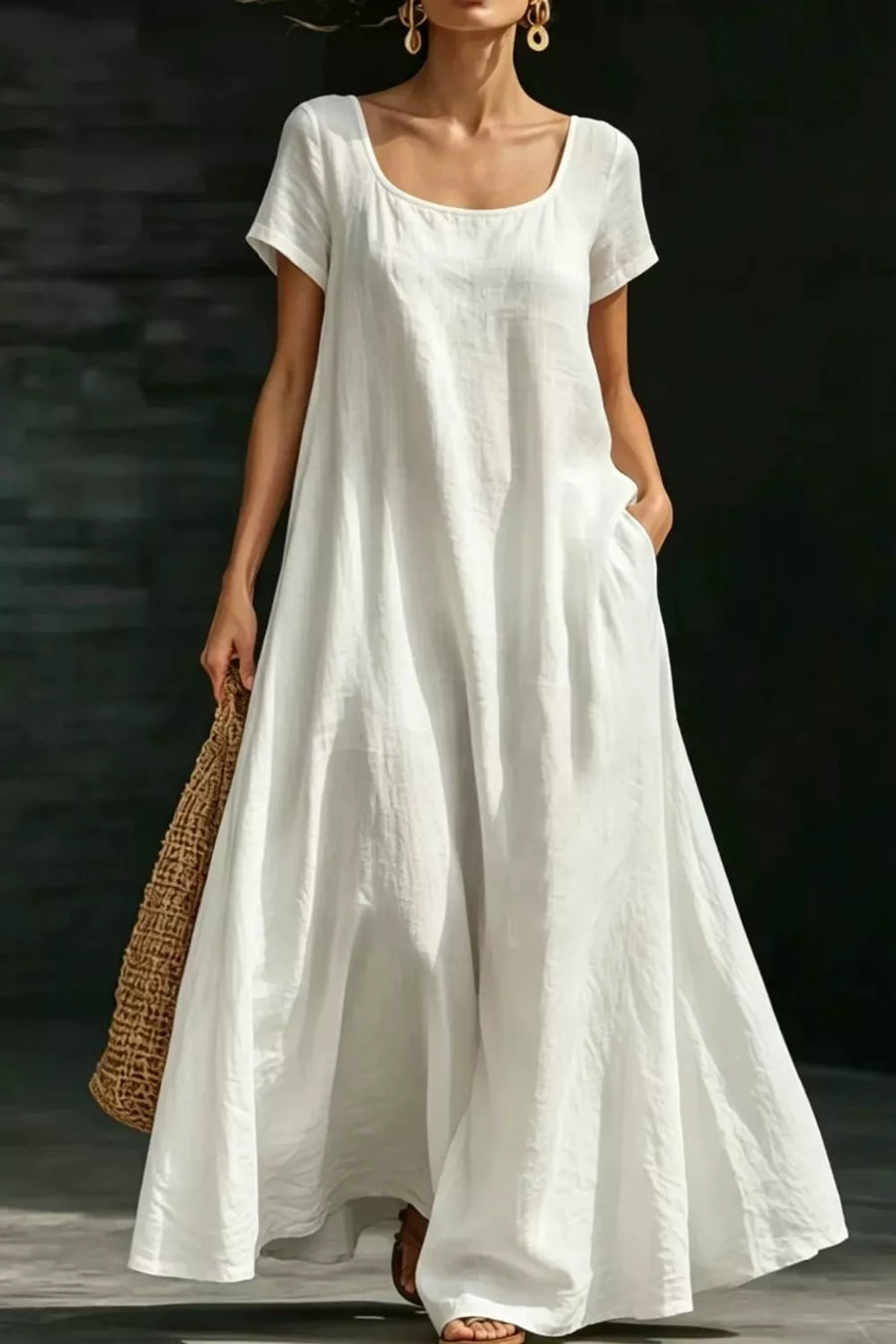 White polyester maxi dress with short sleeves, scoop neck, and pockets.