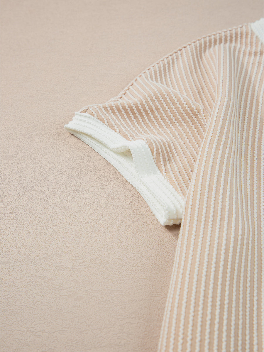 Beige striped t-shirt dress with white ribbed trim on the sleeves.