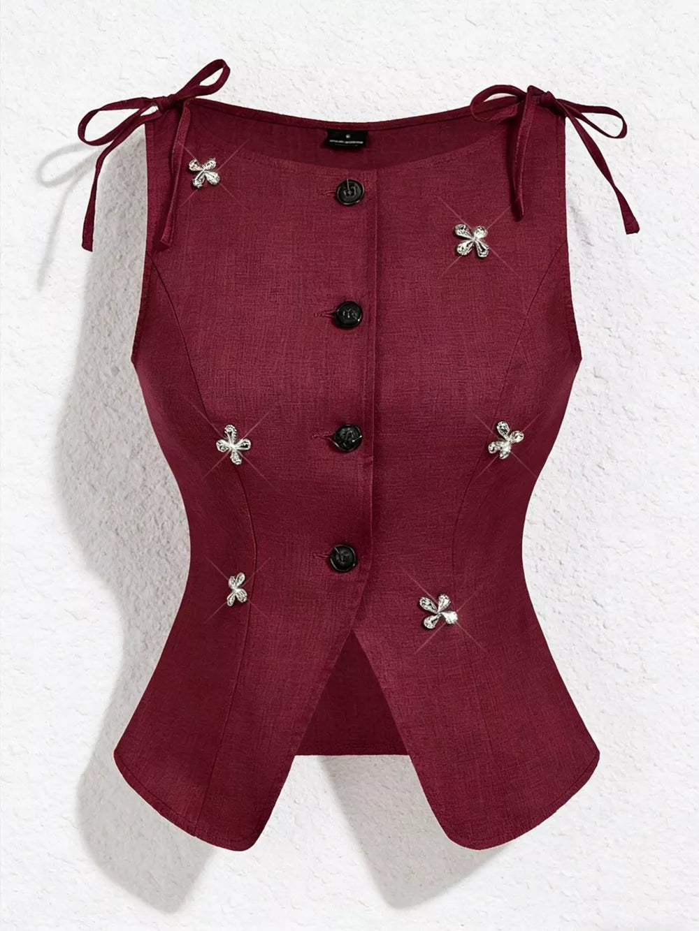 Burgundy tie-shoulder vest with button front and floral appliqués