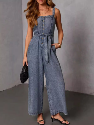jumpsuit in washed denim blue featuring button-front bodice and wide-leg fit