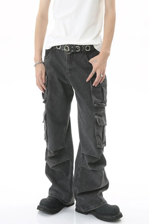 Baggy dark wash denim cargo pants with multiple pleated pockets and a relaxed fit.