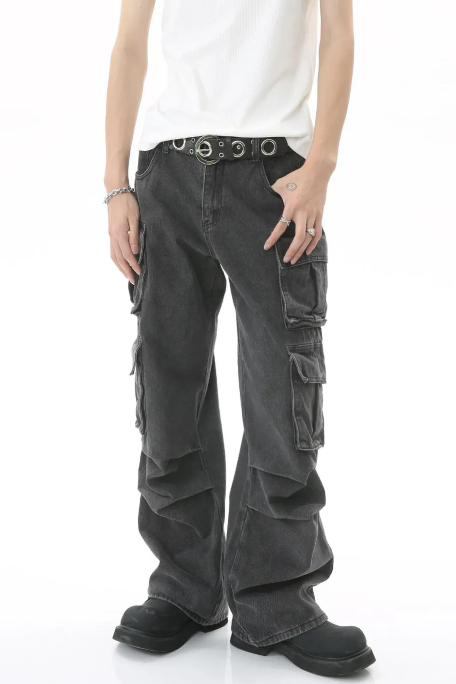 Baggy dark wash denim cargo pants with multiple pleated pockets and a relaxed fit.