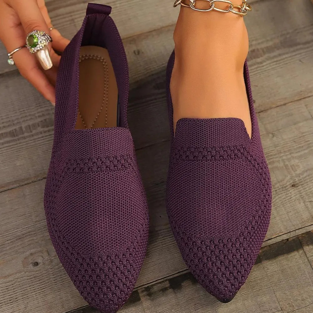 Plum purple knit pointed toe flats with textured detail.