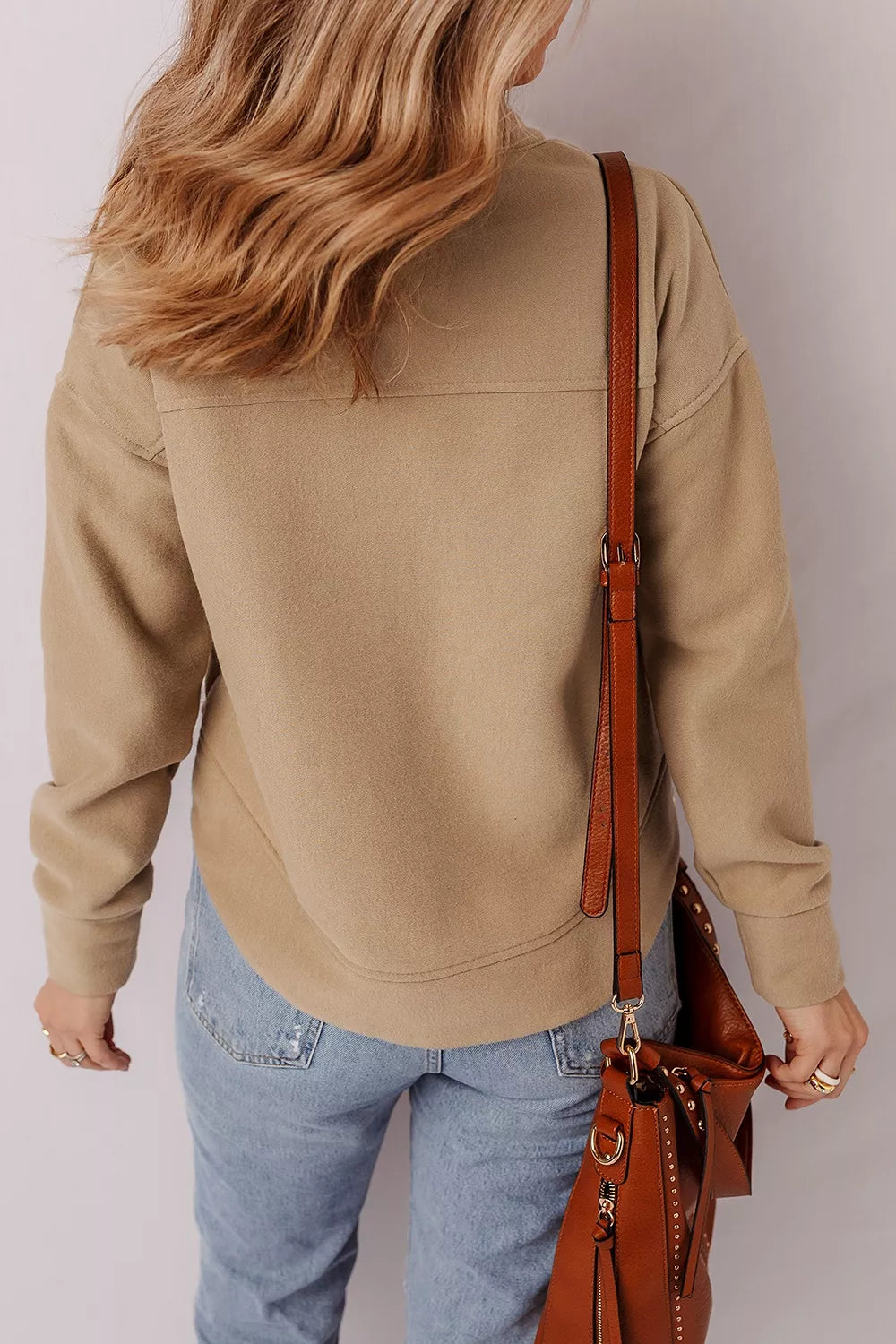 50% polyester, 50% cotton Care instructions: Machine wash cold sweatshirt in camel with relaxed silhouette