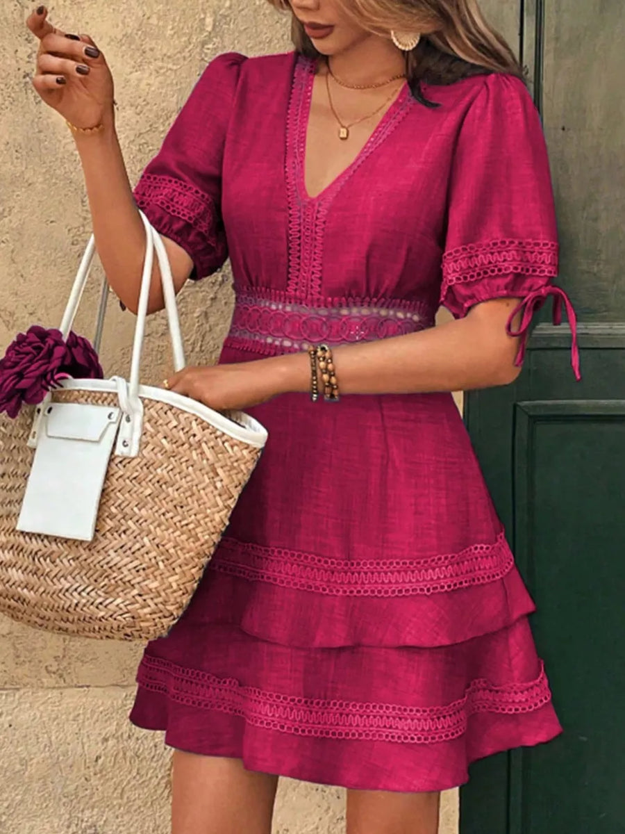 Rose red lace-embellished V-neck mini dress with tiered skirt and tie sleeves.