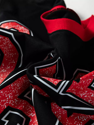 Black sweatshirt with red and white varsity graphic detail and red ribbed cuffs.