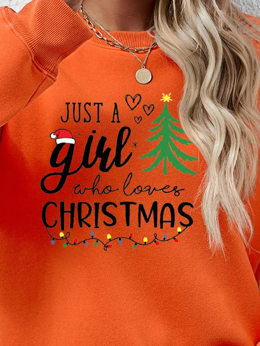 Orange Christmas graphic sweatshirt with text and holiday lights.
