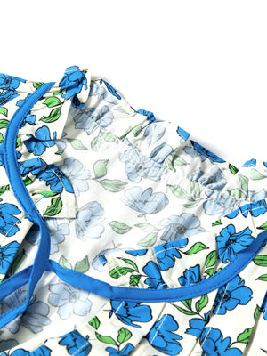 Floral ruffle sleeve tie-neck shirt with blue floral print and contrast trim.