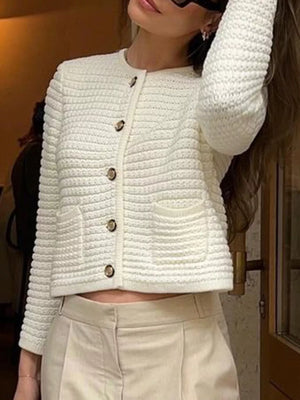 Textured white button-down cardigan with gold buttons and two front pockets.