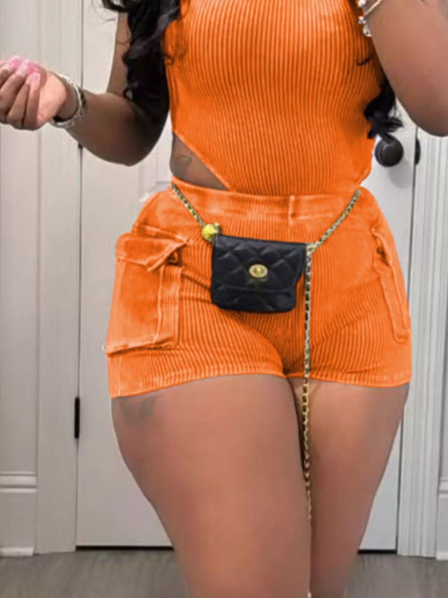 Orange ribbed crop top and pocket shorts set with a chain belt and mini purse.