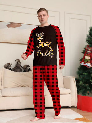 pajama set in red with plaid and reindeer graphic