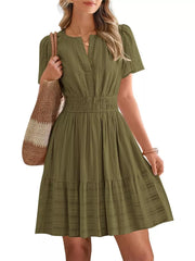 Army green textured V-neck tiered dress with smocked waist and short sleeves.