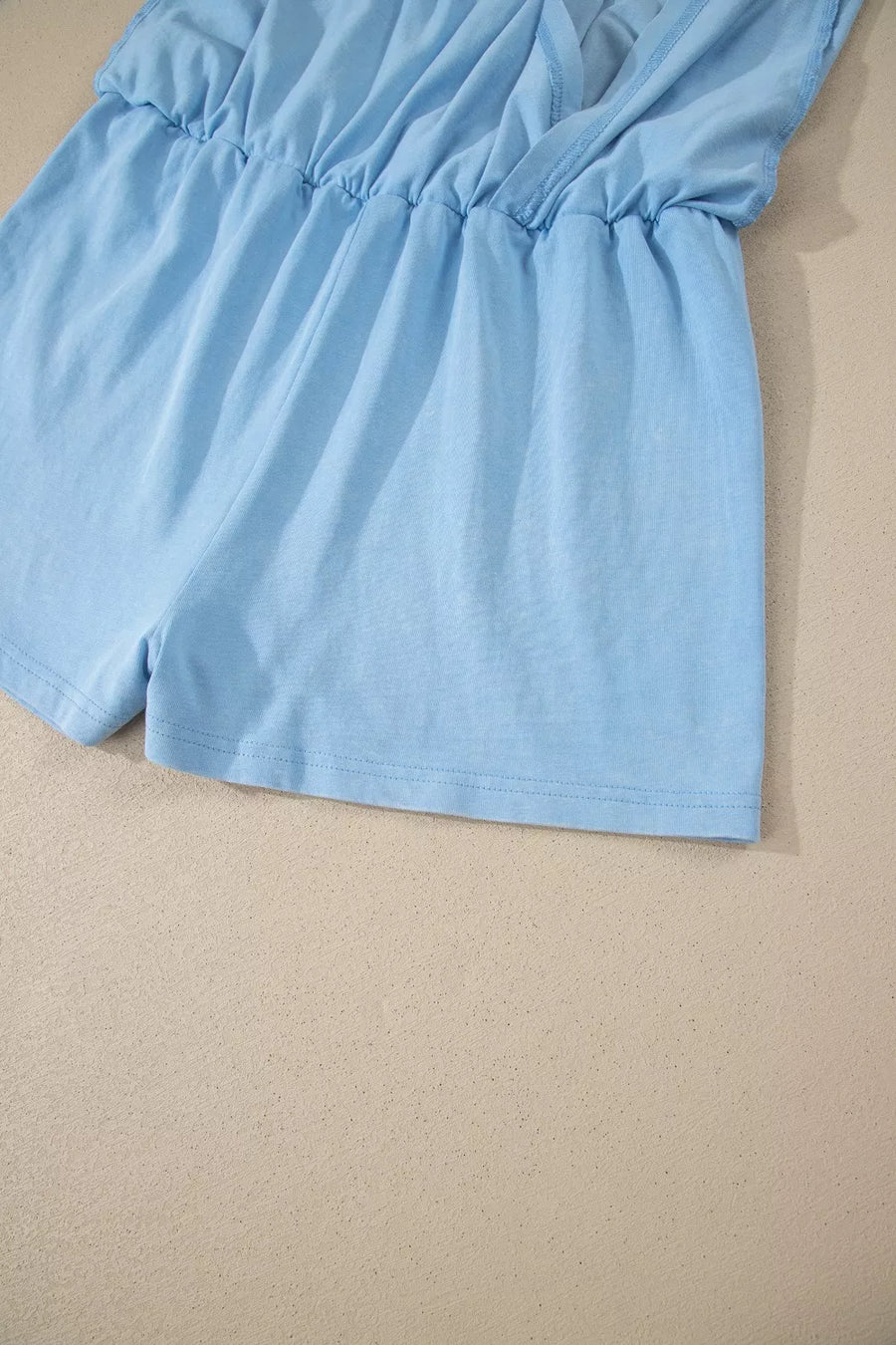 Light blue cotton relaxed V-neck top and skort ensemble with elastic waist detail