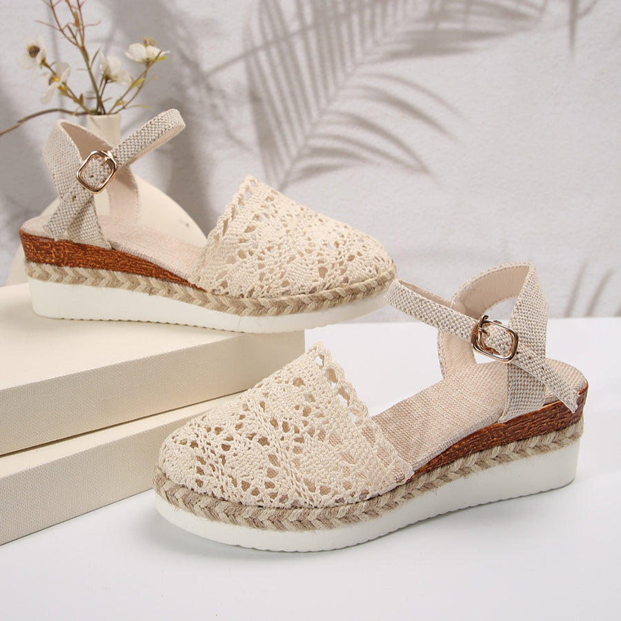 Ivory crochet espadrille sandals with ankle strap and jute platform sole.