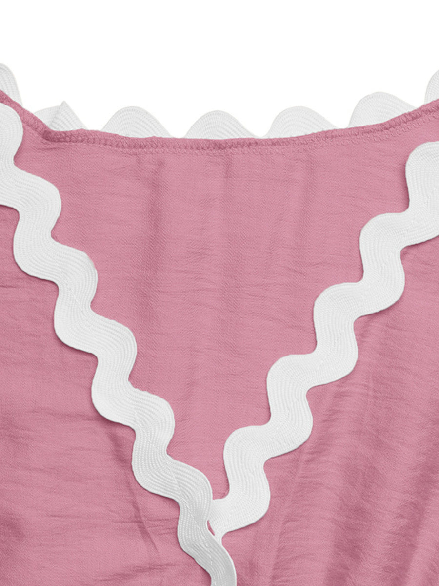 Pink maternity romper cover-up with white scalloped trim detail