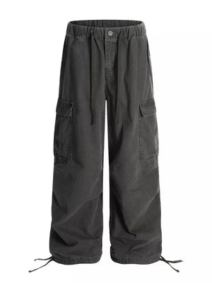 Grey cargo pants with adjustable drawstring waist and hem, featuring multiple pockets.