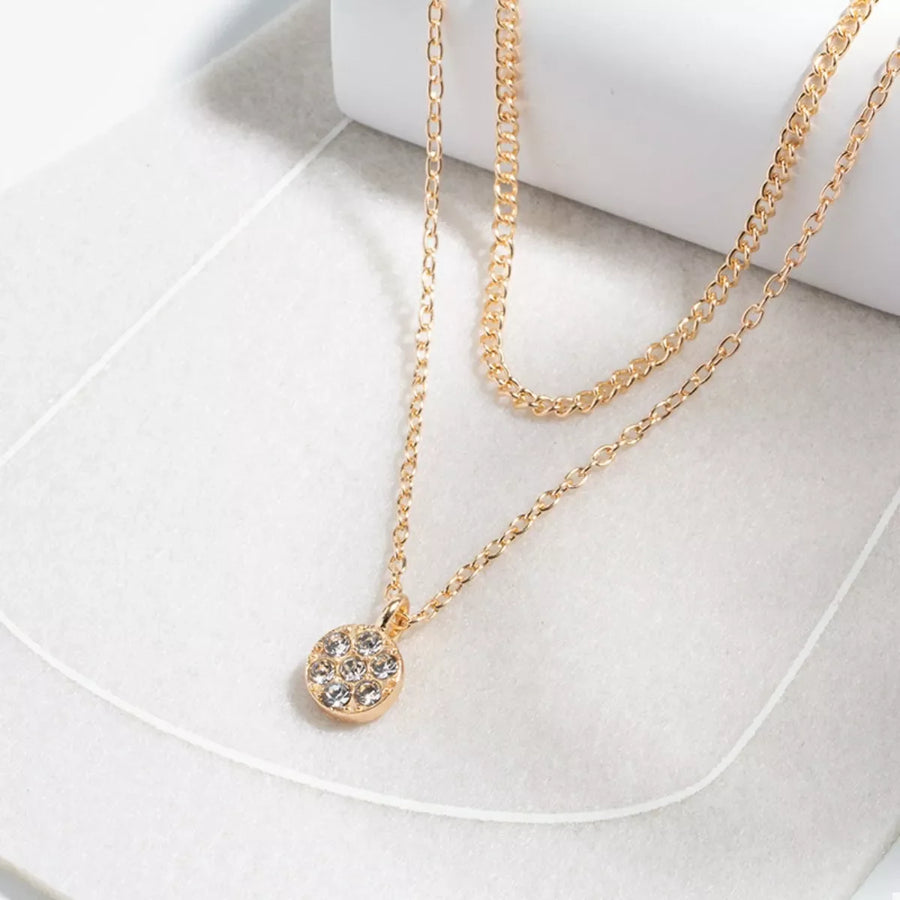 Gold double layered pendant necklace with clear crystal accents