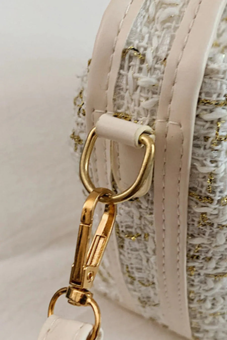 Ivory tweed box bag with gold hardware and detachable strap detail