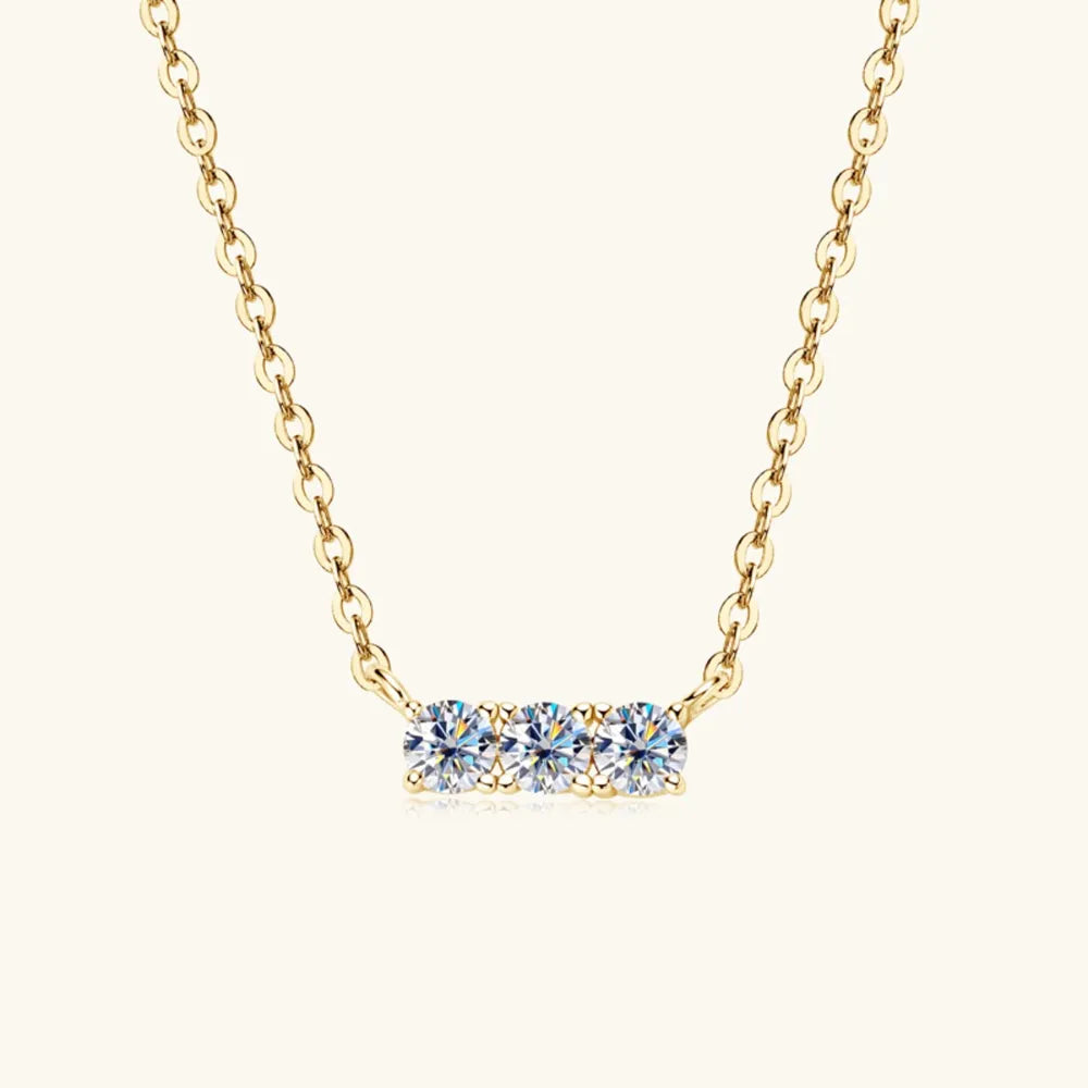 Gold bar necklace with three round moissanite stones, 18K gold-plated.