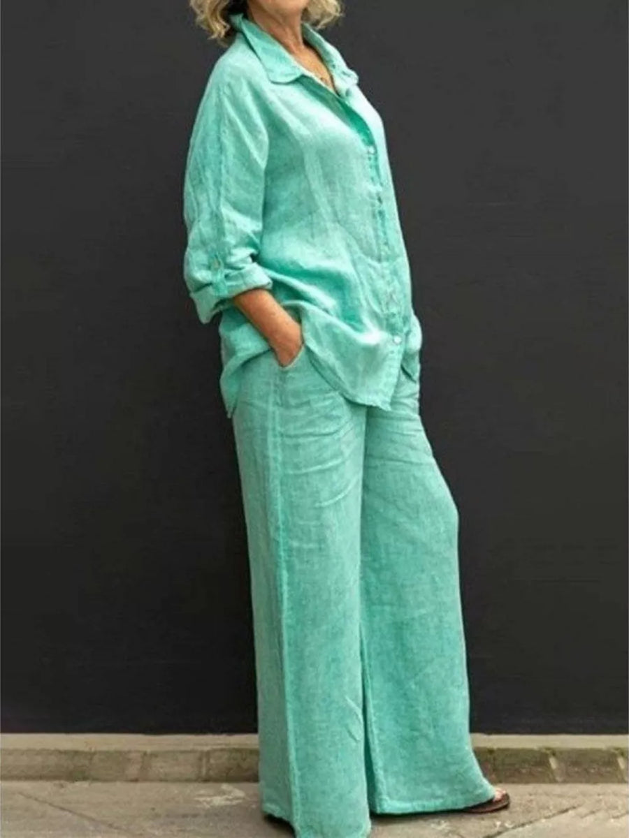 Relaxed two-piece set in green with button-down collared top and wide-leg pants.
