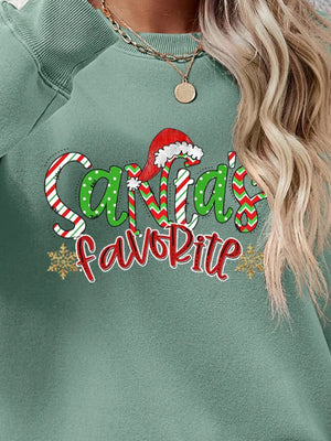 Sage green crewneck sweatshirt with Santa's Favorite festive graphic and snowflakes.