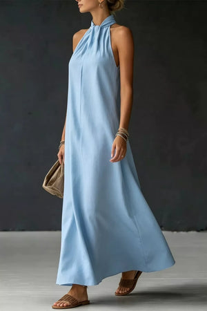 Light blue cotton blend maxi dress with twisted halter neckline and A-line cut.