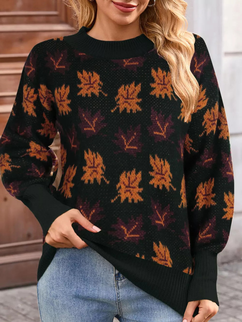 black mock neck sweater with leaf-print and mock neck