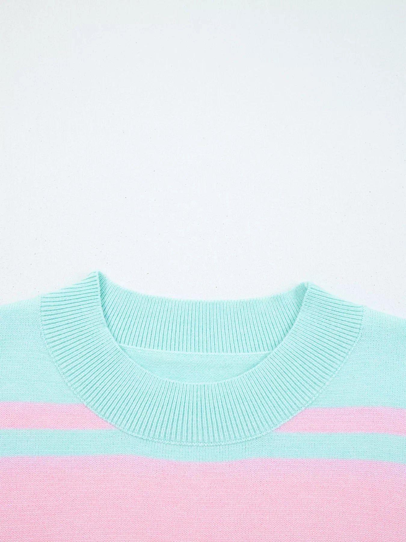 Multicolor striped cropped sweater with ribbed crew neck and cuffs.