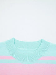 Multicolor striped cropped sweater with ribbed crew neck and cuffs.