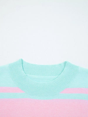 Multicolor striped cropped sweater with ribbed crew neck and cuffs.