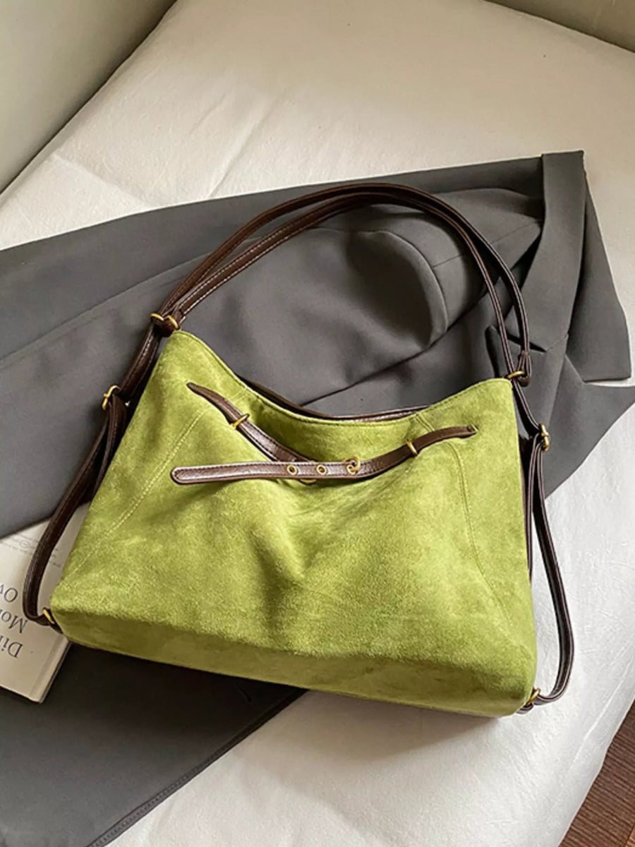 Green suede large tote bag with brown leather straps and buckle details