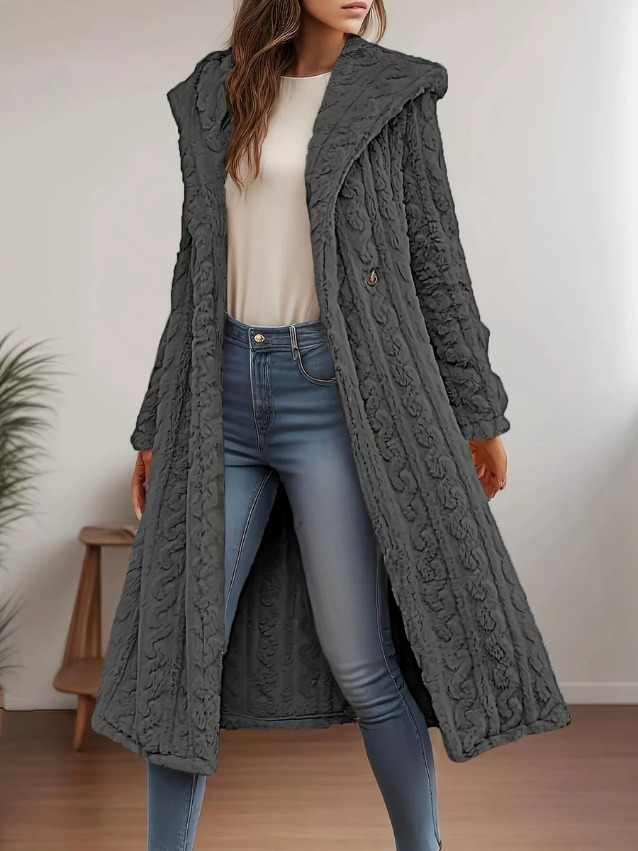 Gray hooded longline button up coat with cable knit texture and button closure.