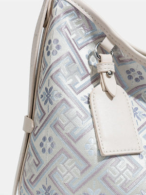 cream handbag with zip and geometric