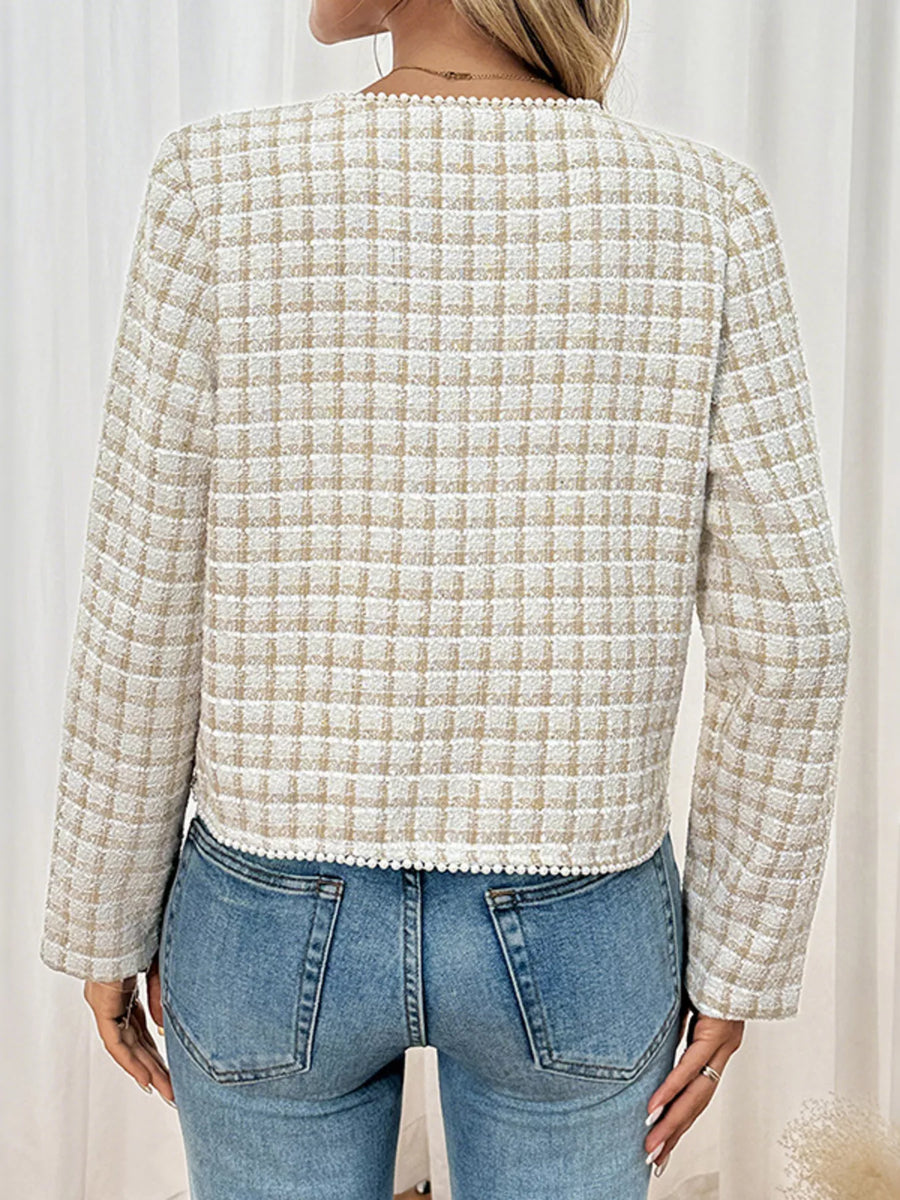 Apricot tweed jacket with pearl trim and plaid pattern.