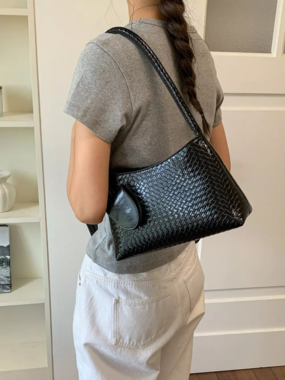 shoulder bag in black with geometric and woven texture
