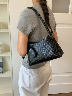 shoulder bag in black with geometric and woven texture