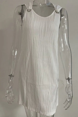 White textured V-neck mini dress with ring straps and asymmetrical hem.